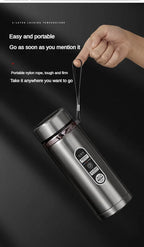 Portable stainless LED thermos with carry loop and open cup lid