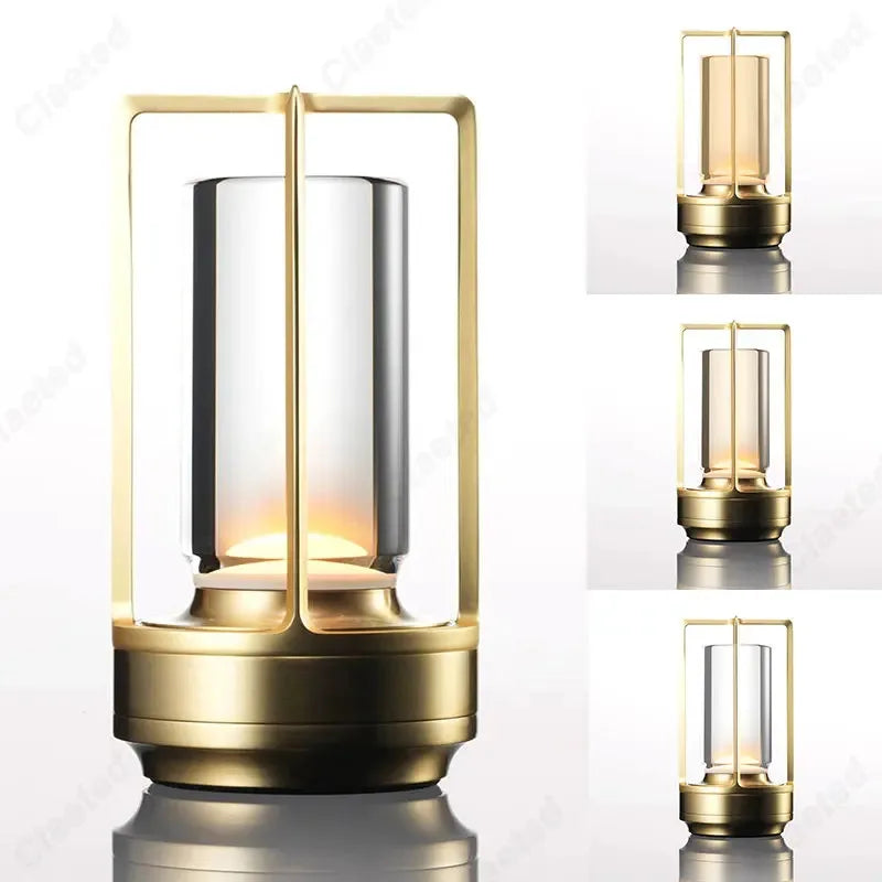 Gold lantern-style table reading lamp with rectangular glass frame and warm light