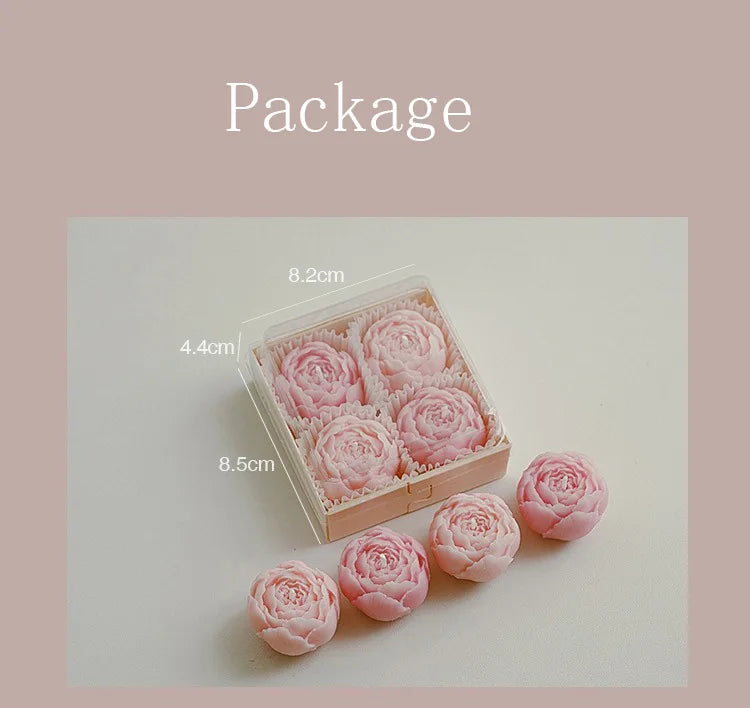 Rose-scented candle gift box with pink rose-shaped candles and extra loose candles
