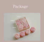 Rose-scented candle gift box with pink rose-shaped candles and extra loose candles