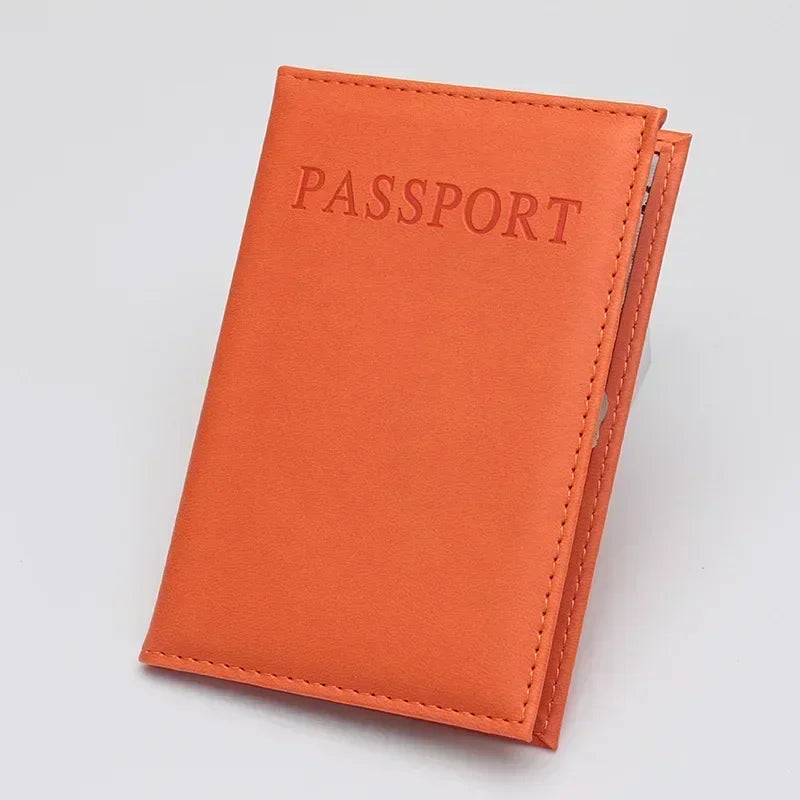 Burnt amber classic travel passport sleeve with “PASSPORT” text and stitching
