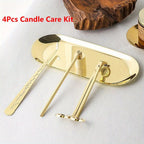 Gold-toned 4-piece candle care kit with tray, scissor, poker, and wick trimmer