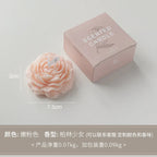 Peony sculptural scented candle, peach-pink flower with box and size markers