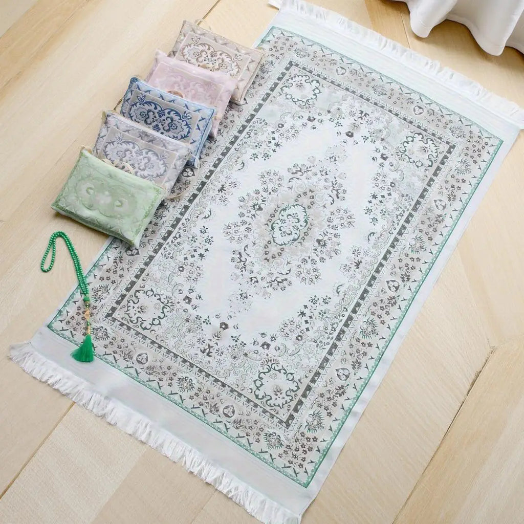 Prayer rug gift set with green patterned prayer mat, tassels, and small storage pouches