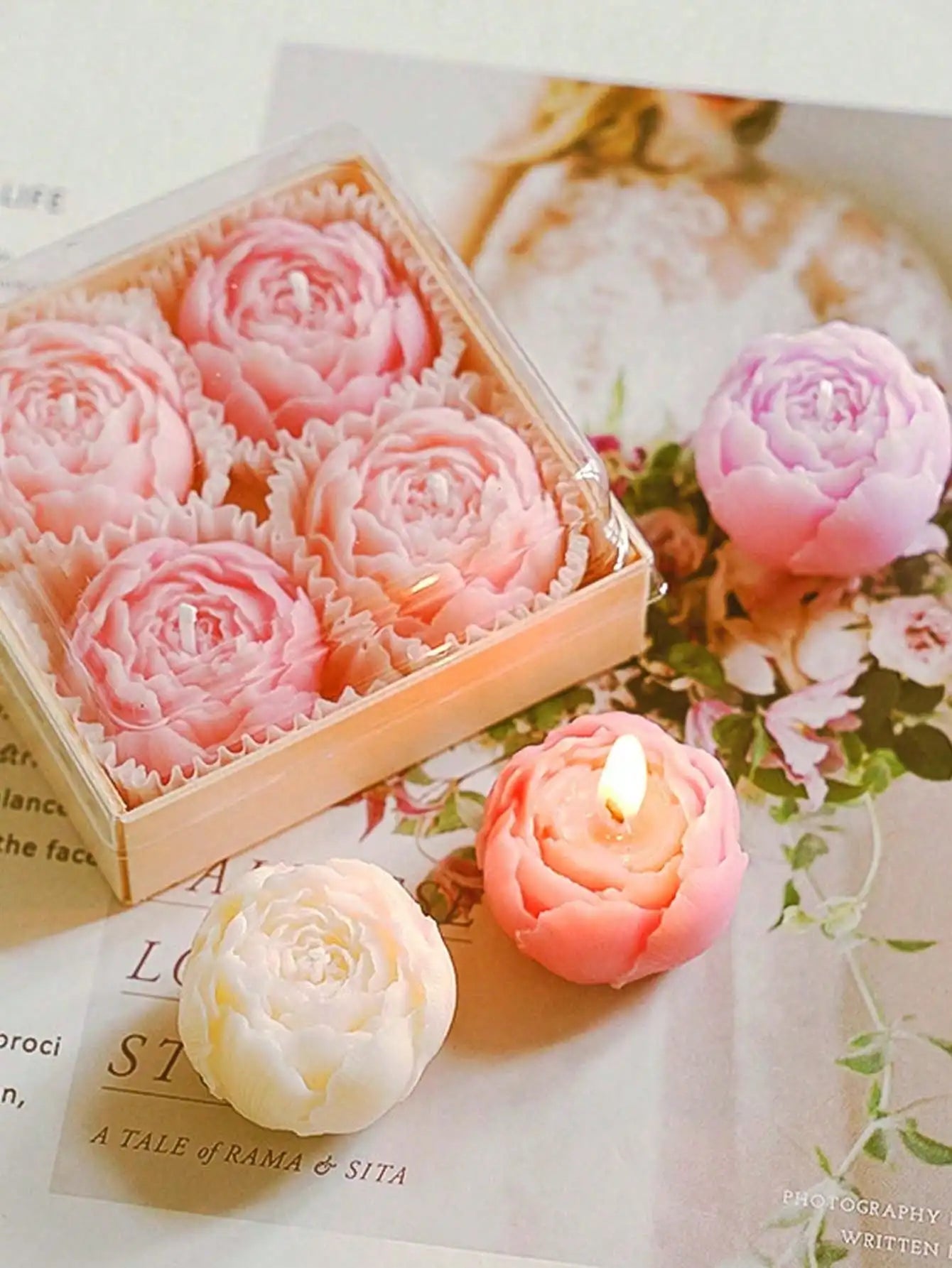 Floral candle set: pink rose-shaped candles in open box with wicks