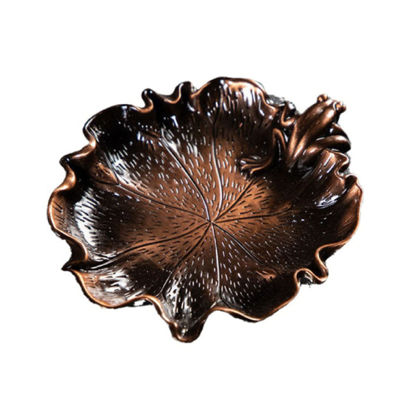 Leaf-shaped metal incense basin with detailed vein texture, plum-branch style tray