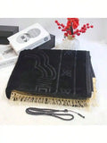 Velvet padded prayer rug in black with raised arch pattern and cream fringe trim, plus beads.