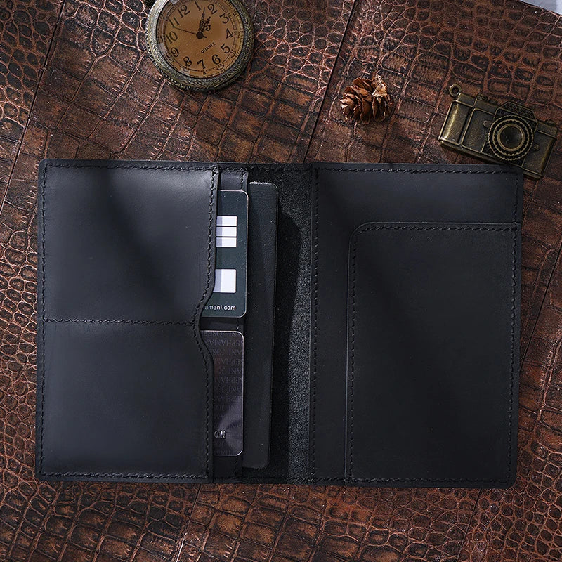 Obsidian black passport wallet opened: two left card slots and one right card pocket