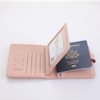 Blush pink passport holder opened: SIM slots and card pocket visible, with travel ID slots