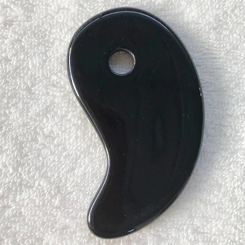 Obsidian black gua sha stone, glossy black teardrop with a center thumb hole.