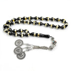 Prayer bead tasbih with black and gold striped beads and silver medallion charms