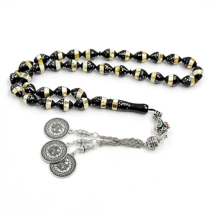 Prayer bead tasbih with black and gold striped beads and silver medallion charms