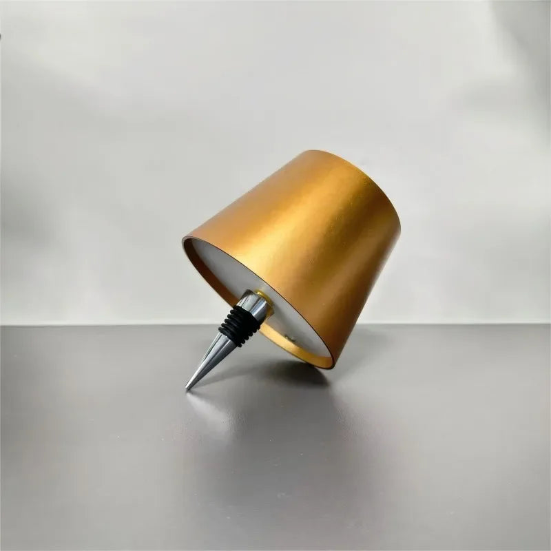Wireless LED wine bottle lamp, champagne gold cylindrical shade with spike base