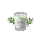 Light green glass scented candle with herb sprigs, gift-ready