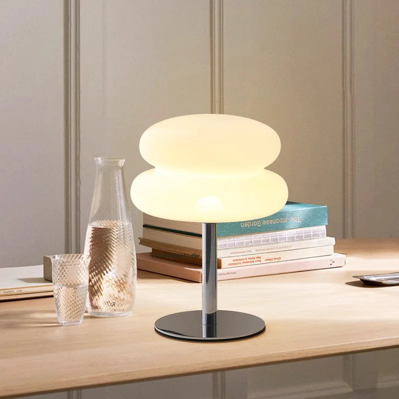 Mushroom USB ambient table lamp lit with warm white; stacked dome shade and chrome stand.
