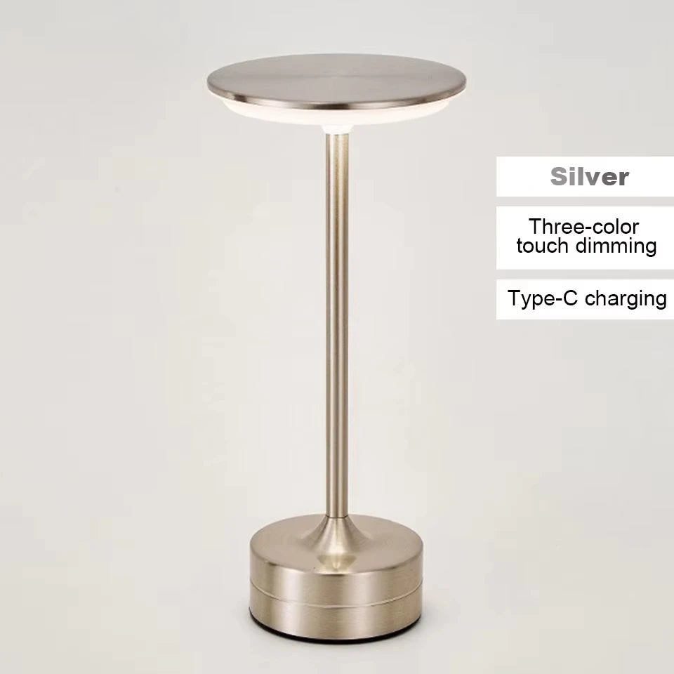 Silver cordless reading lamp with touch dimming, round top and compact base
