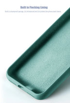 Silicone MagSafe phone case in teal-green with textured interior lining and edge protection