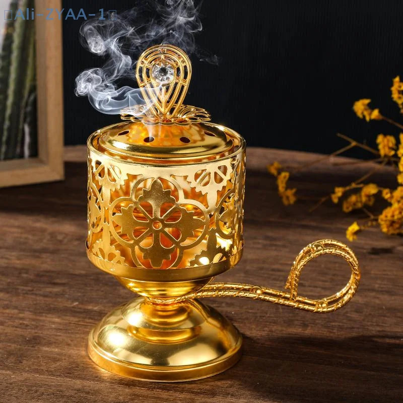 Arabesque incense burner, gold-toned pierced cylinder with ornate lid and lifting handle