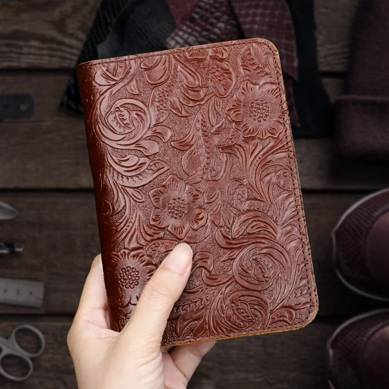 Cognac-brown leather travel folio, floral embossed surface, card pocket
