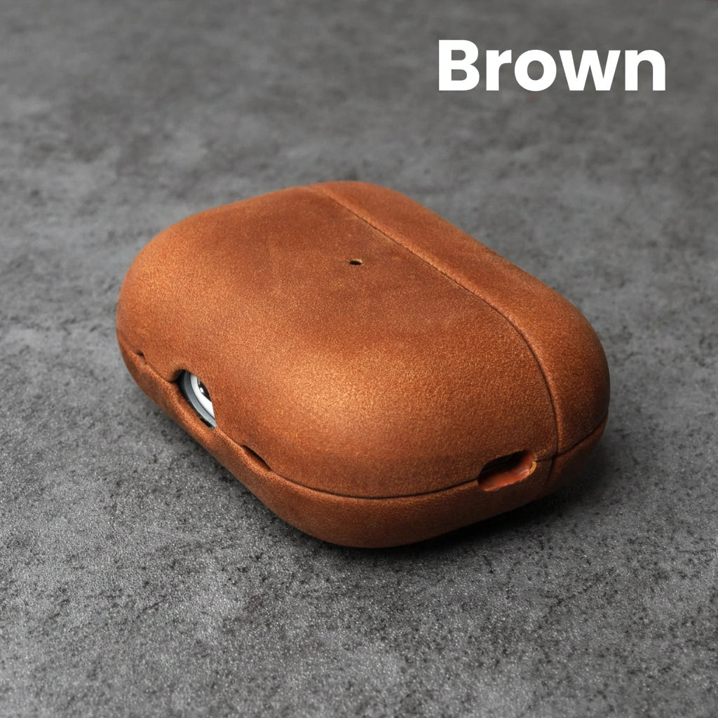 Brown leather AirPods case with front cutouts and smooth rounded shell