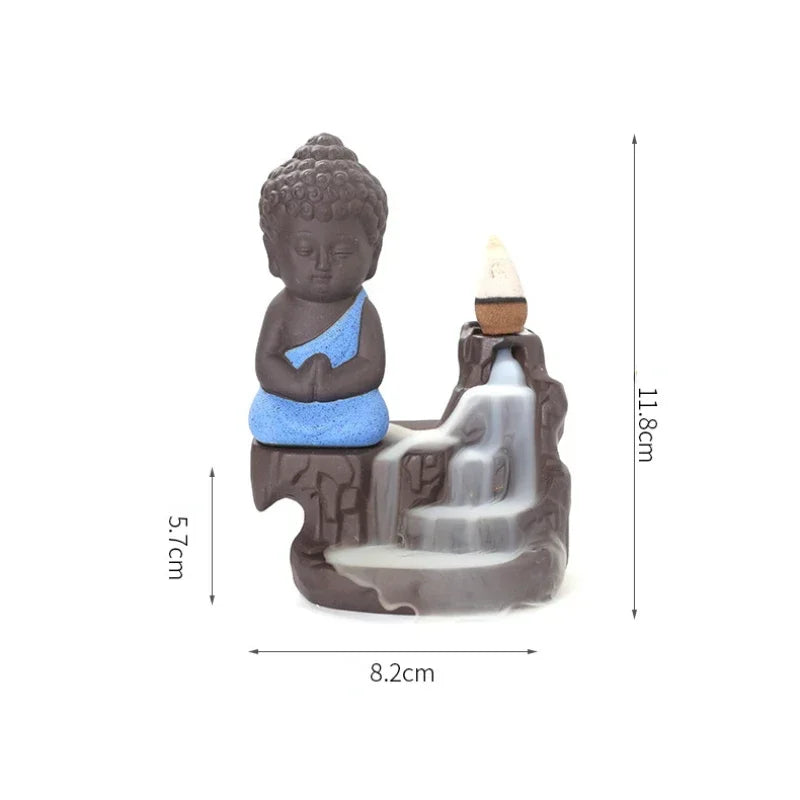 Backflow incense burner with blue-robed Buddha and stone incense cone