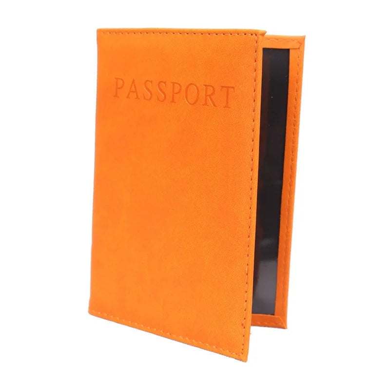 Orange passport sleeve with embossed “PASSPORT” and black inner panel