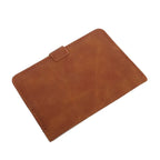 Cognac brown passport cover with top fastening tab and stitched borders