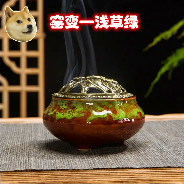 Ceramic incense burner with green and brown mottled glaze, bronze dome lid