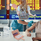 Blush pink passport folio in use, holding cards and passport while traveling