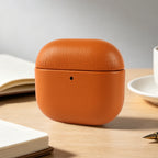 Light brown eco-leather AirPods case, rounded clamshell with small front opening