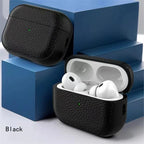 Black leather AirPods case with lid open and earbuds inside