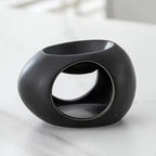 Black ceramic aroma burner with oval cutout and open top