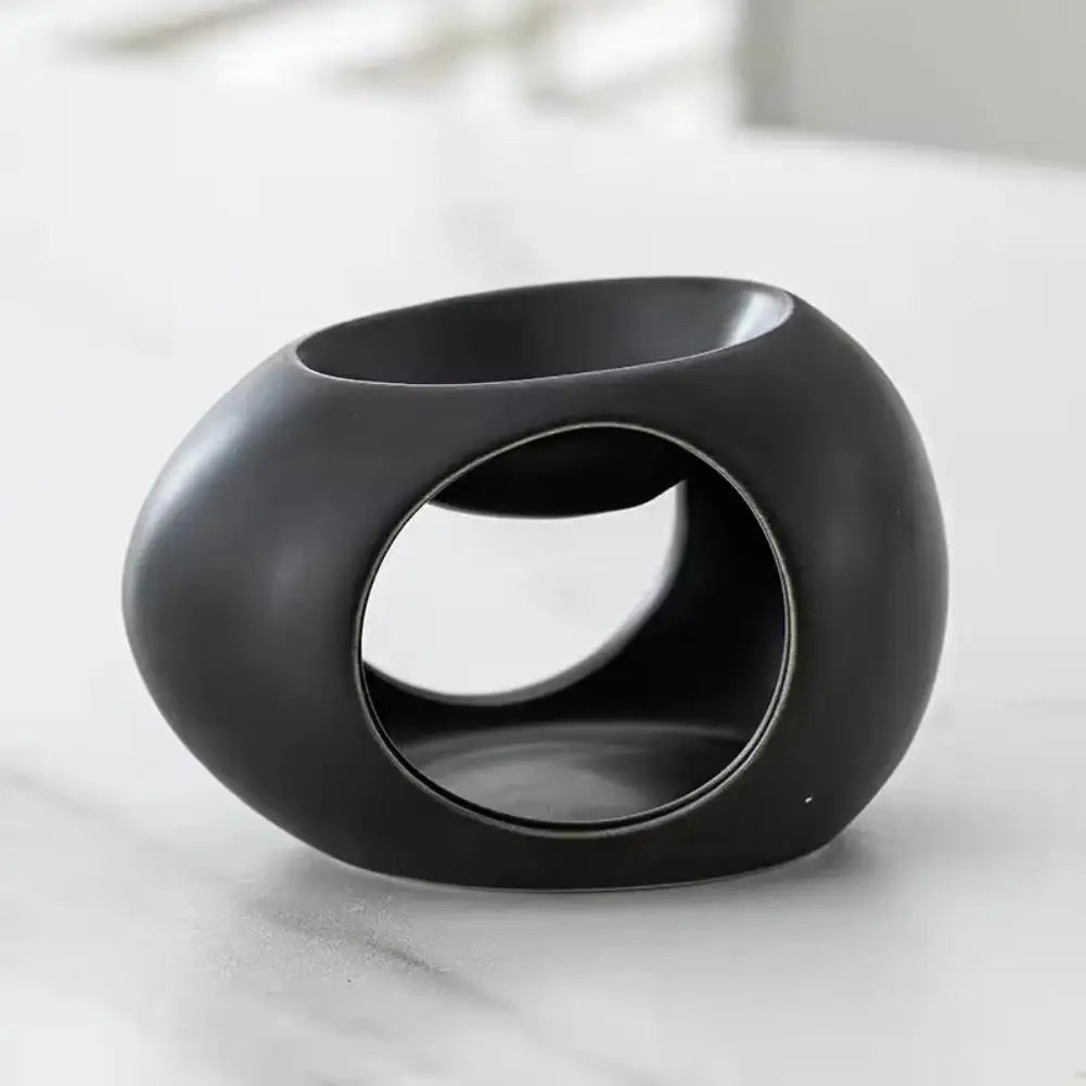 Black ceramic aroma burner with oval cutout and open top