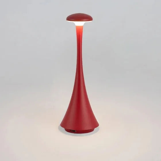 Ruby red cordless mushroom touch table lamp, tapered body with glowing circular top diffuser.
