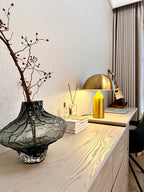 Gold mushroom table lamp with dome shade on console