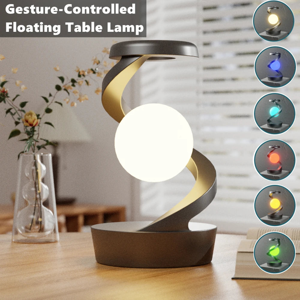 Floating wireless charging atmosphere lamp with warm white glowing orb, dark gray base