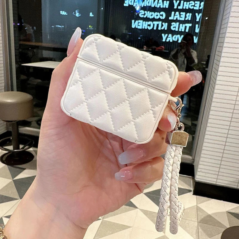 White quilted leather AirPods case with lanyard strap and metal clasp