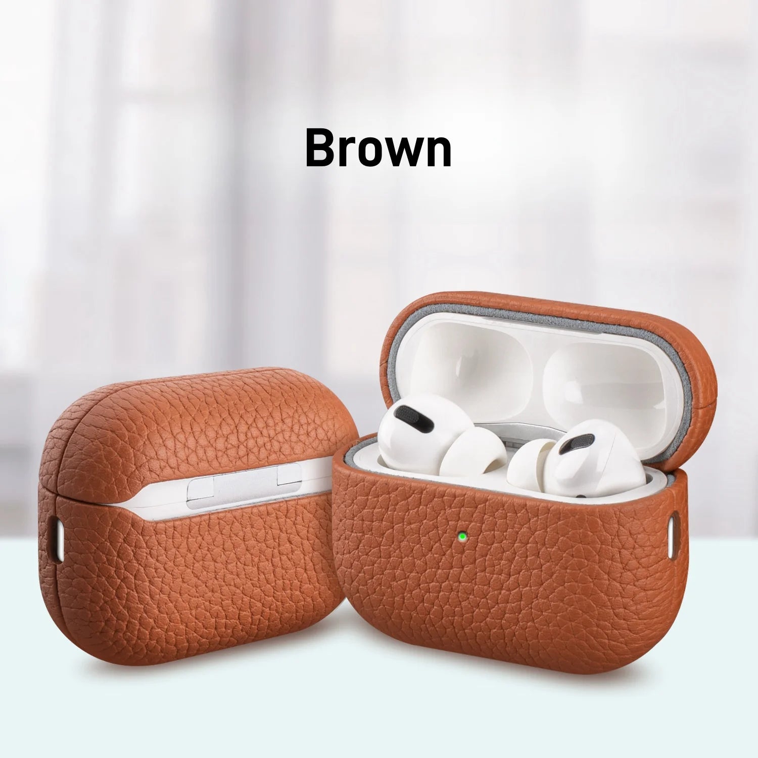 Brown leather AirPods Pro case with lid open, earbuds visible inside