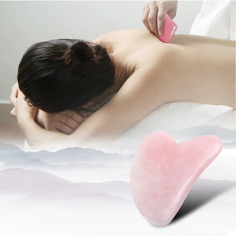 Rose quartz gua sha stone used on neck and shoulder during massage