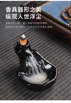 Black glossy backflow incense tower burner with cone incense and swirling smoke
