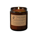 Luxury glass cup scented candle in amber jar with an upright flame