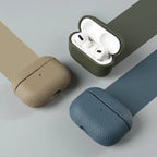 Cowhide leather AirPods case set in tan, dark green, and blue with open top