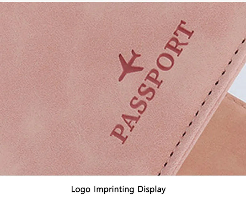 Pink passport folio close-up with embossed “PASSPORT” logo and stitched border