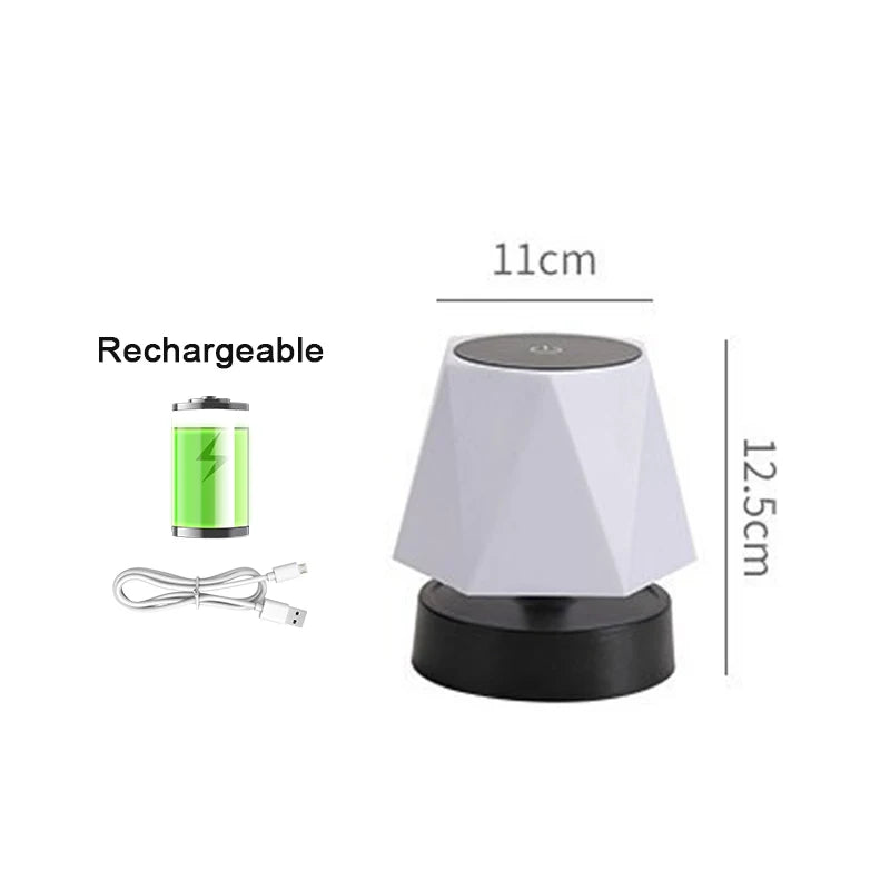 Rechargeable cordless LED lamp with white shade and black base; 11cm wide, 12.5cm tall