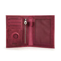 Cardinal red leather passport wallet interior with card slots, zipper pocket, and round AirTag window