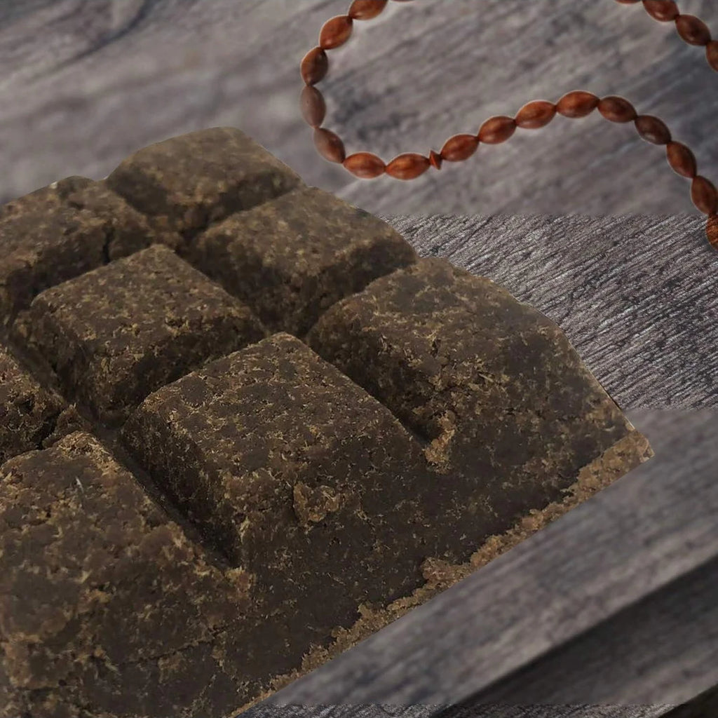 Dark brown bakhoor incense bricks arranged on a textured surface