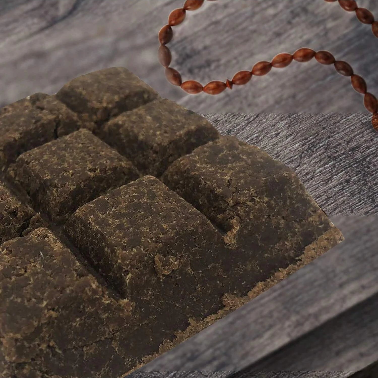 Dark brown bakhoor incense bricks arranged on a textured surface