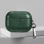 Forest green leather AirPods case with metal keychain clip and charging-LED dot