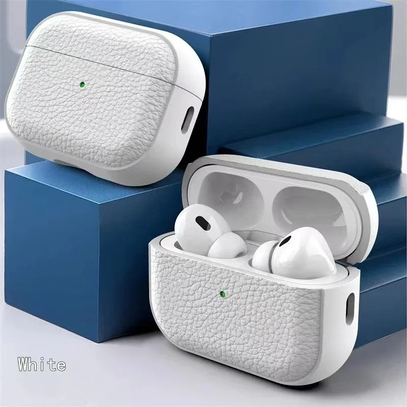 White leather AirPods case with lid open and earbuds inside