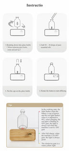 Glass essential oil diffuser on light wood base with clear bottle and control button